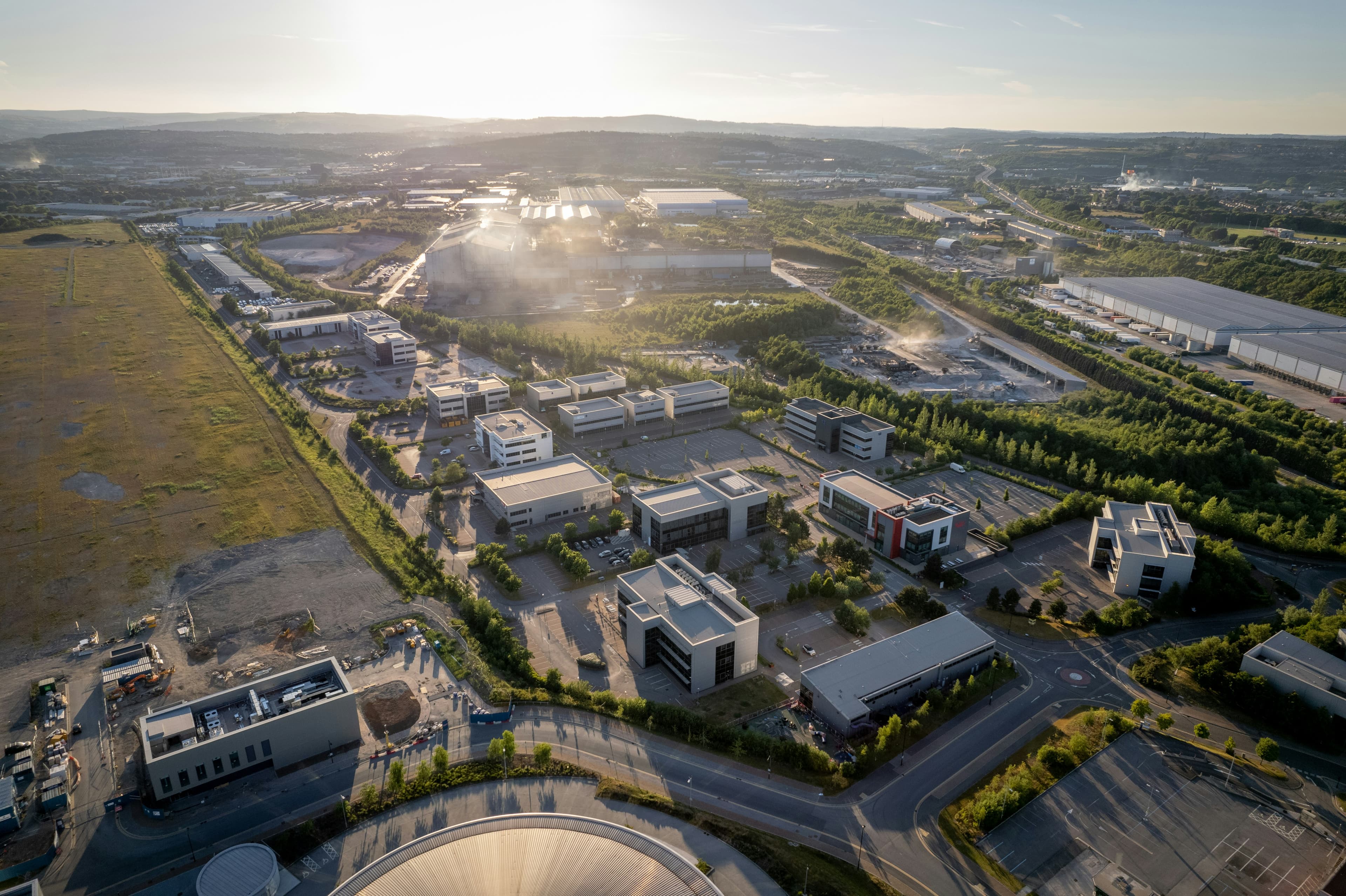 Aerial view of an office park with the sun setting